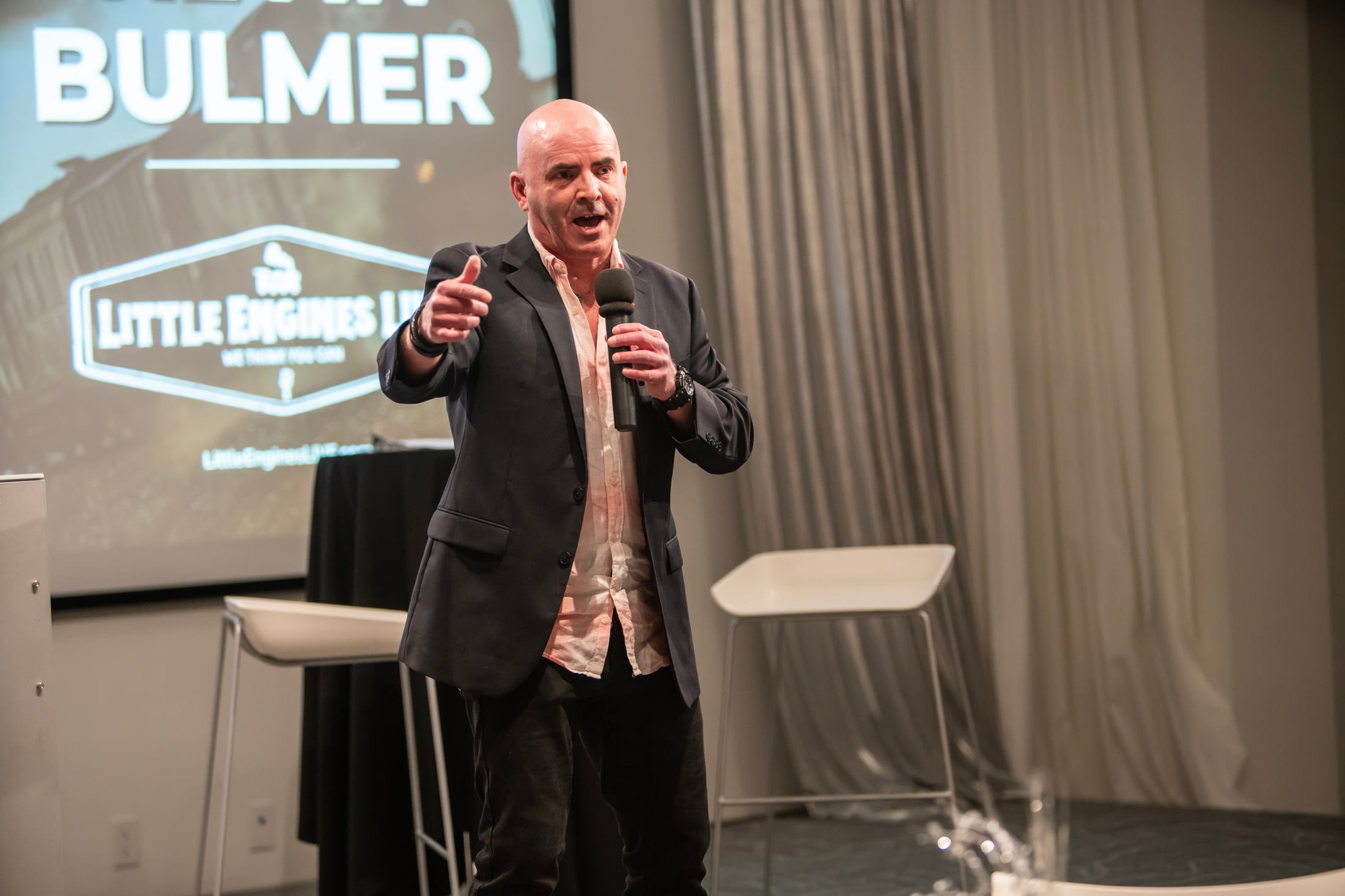Speaker on stage at a conference in London, Ontario